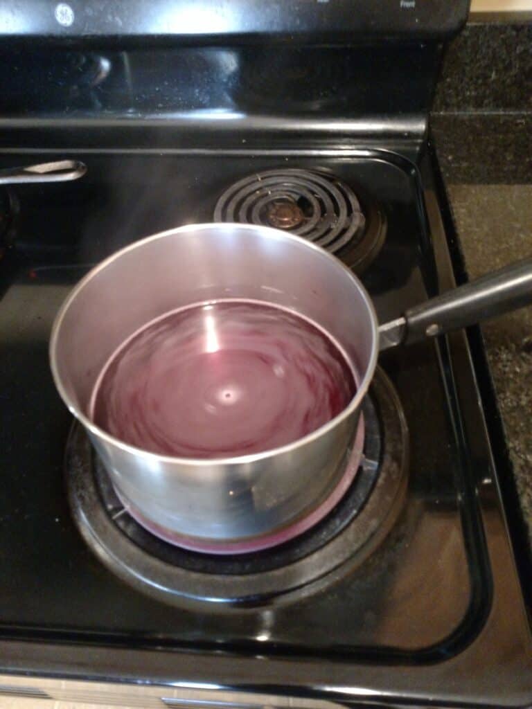 beet juice and water in pan