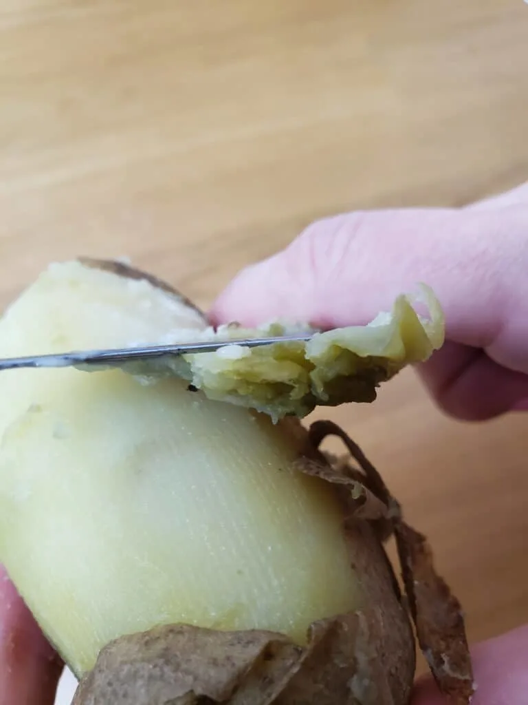 peeling cooked potatoes