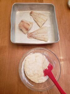 fish in baking dish and topping in bowl