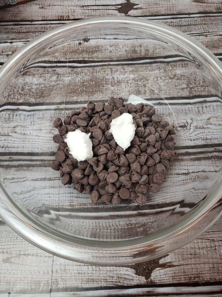chocolate chips and coconut oil in glass bowl
