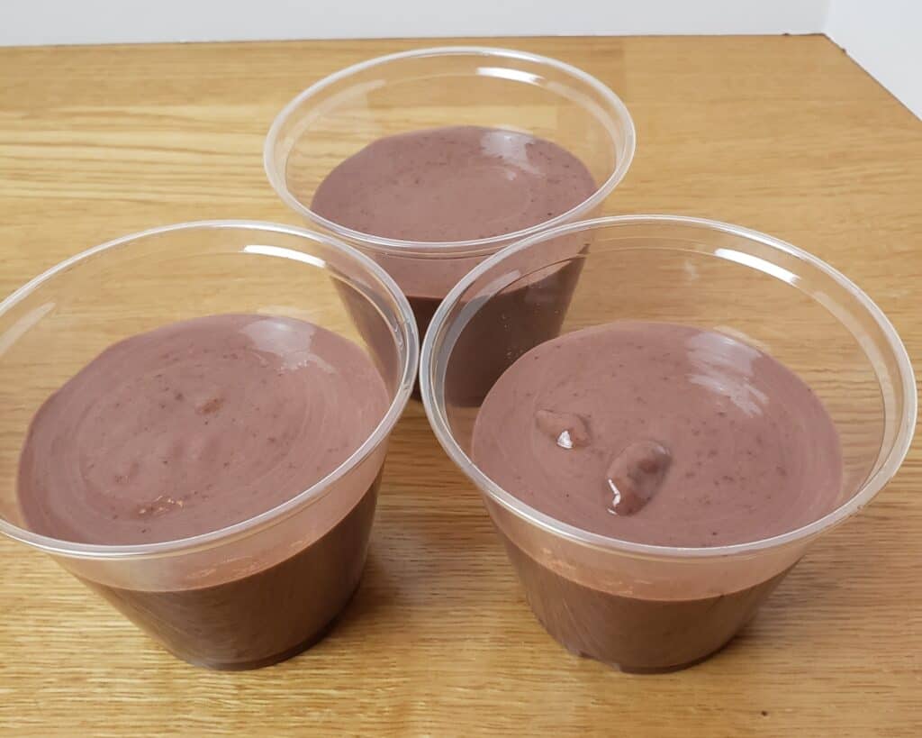 chocolate pudding in 3 plastic cups