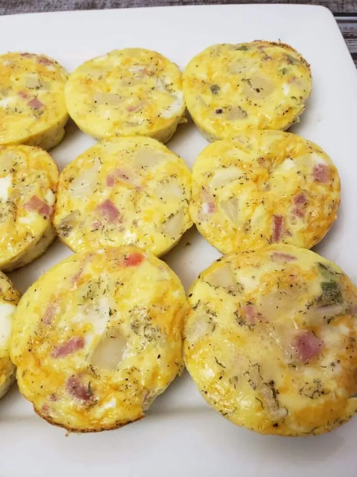 Egg Ham Potato Muffins on white serving dish