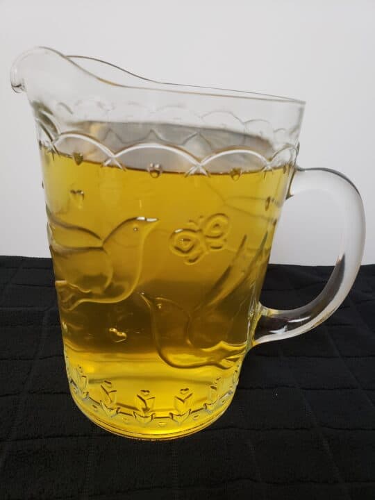 pretty glass pitcher of green tea
