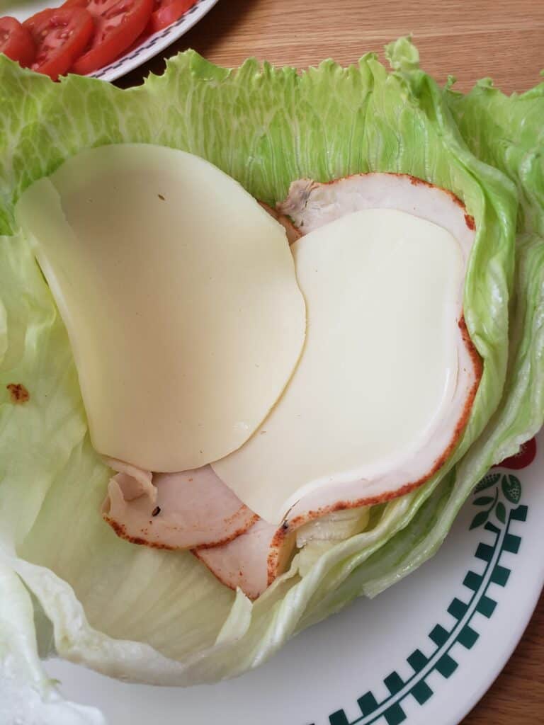 lunchmeat and cheese in lettuce leaves
