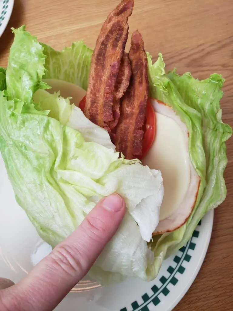 folding a Turkey and Bacon Lettuce Wrap