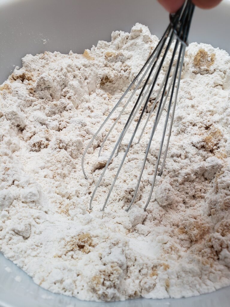 pushing out clumps of brown sugar with whisk