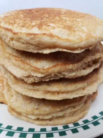 pile of Brown Sugar Oatmeal Pancakes on plate.
