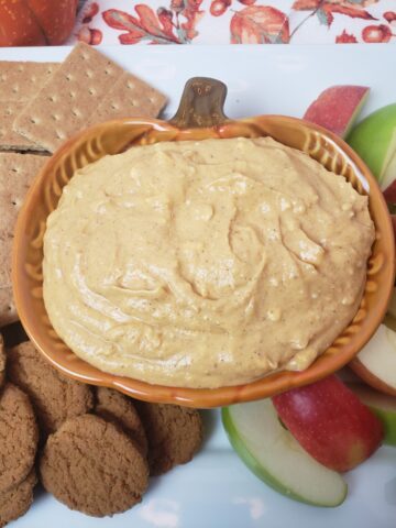 Pumpkin Dip on serving platter with graham crackers, ginger snaps and apple slices