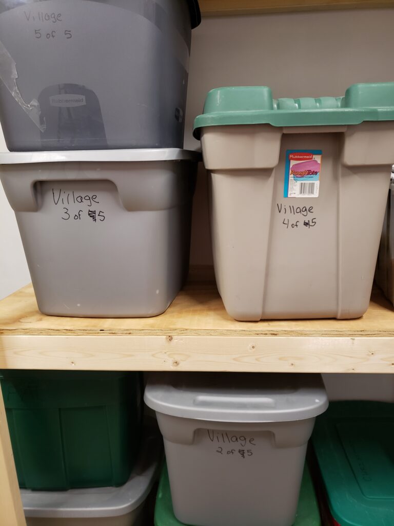 plastic bins piled in storage