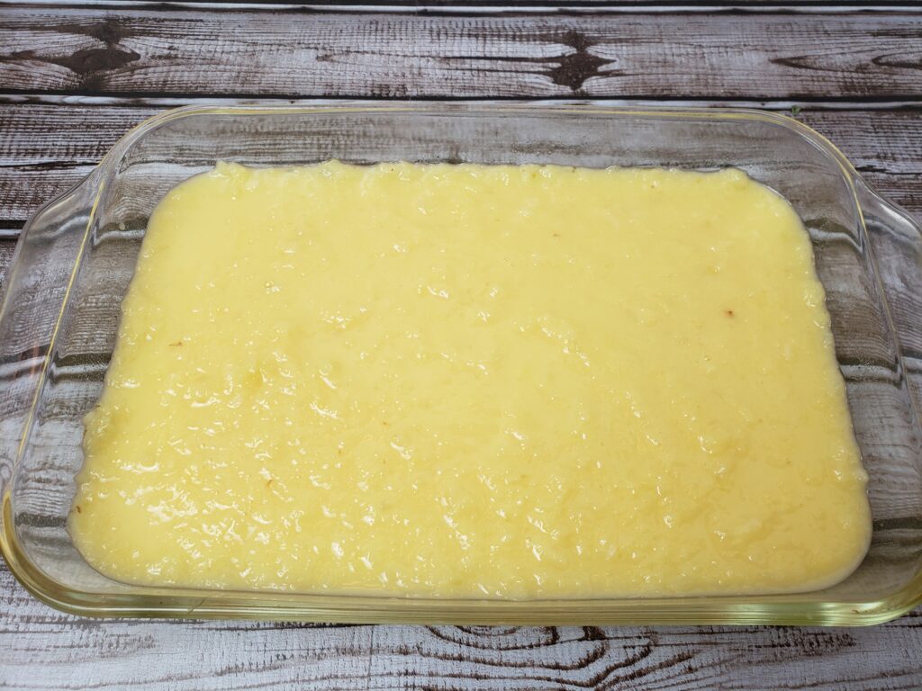 pineapple, eggs, sugar and flour mixture in baking pan