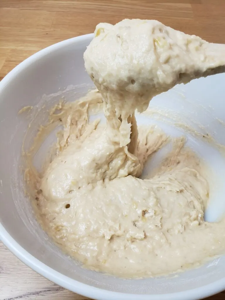 showing thickness of batter on mixing spoon