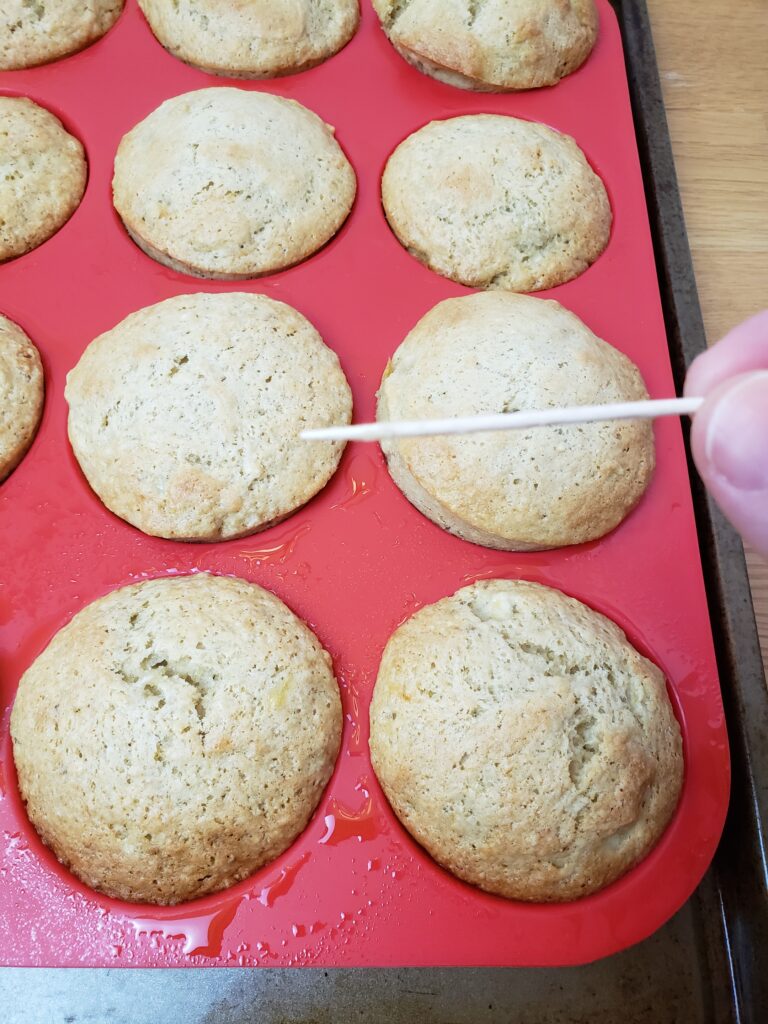 testing for doneness in muffins with toothpick