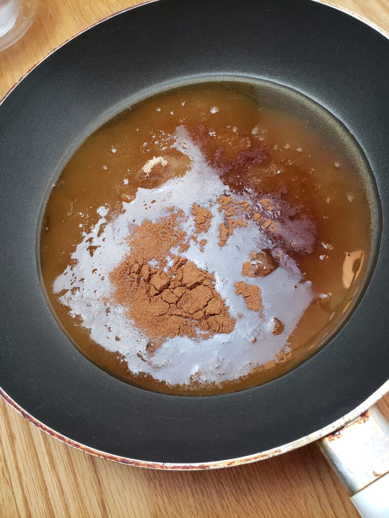 sugar, cinnamon, salt, vanilla and water in skillet