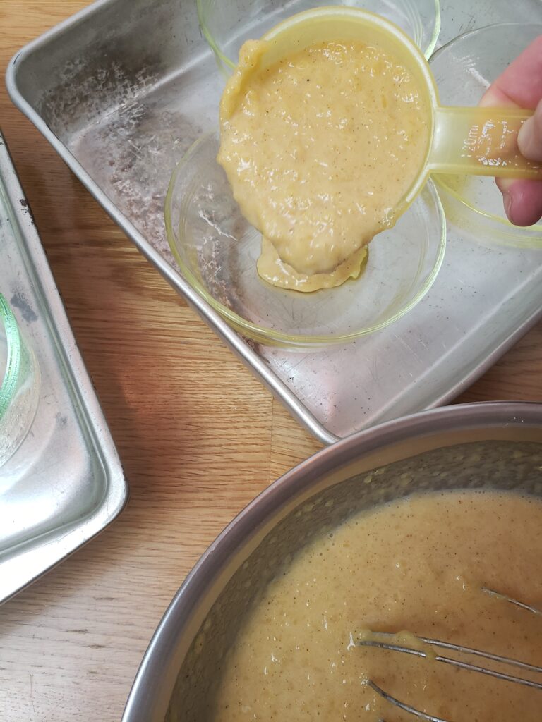 pouring custard into custard cups