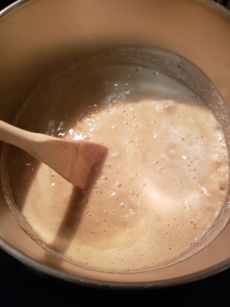 stirring water, milk, oats, pumpkin and pumpkin pie spice in saucepan.