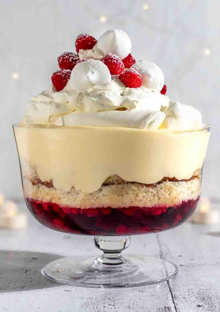 sherry trifle looking beautiful and piled high in glass bowl
