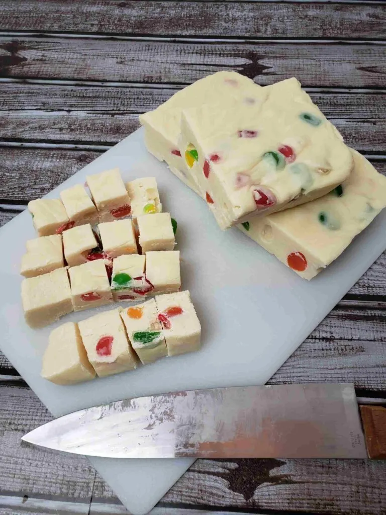 gumdrop fudge on cutting board being cut
