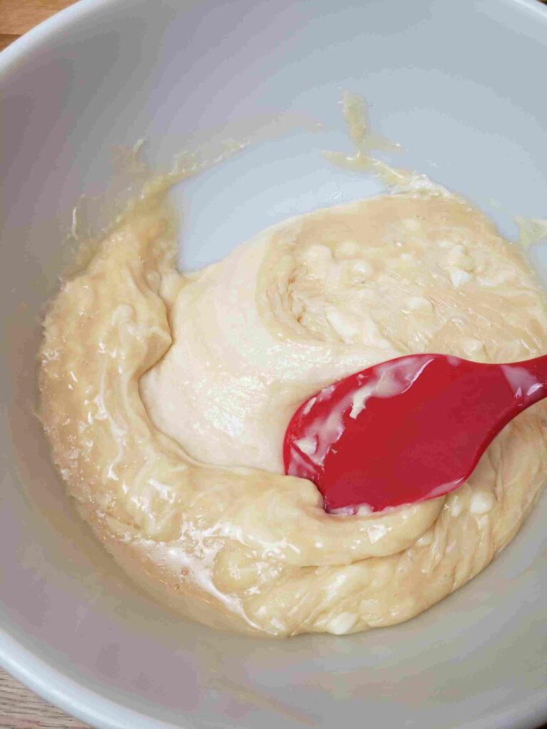 stirring white chips and condensed milk