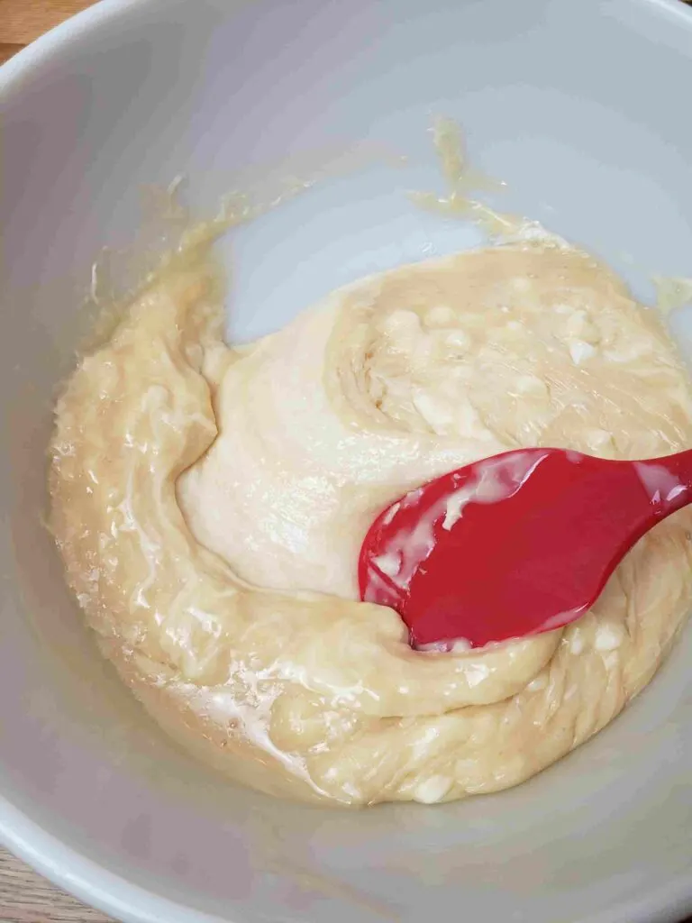 stirring white chips and condensed milk