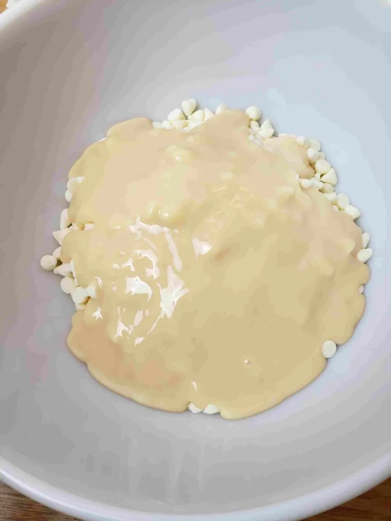 white chips and condensed milk in bowl