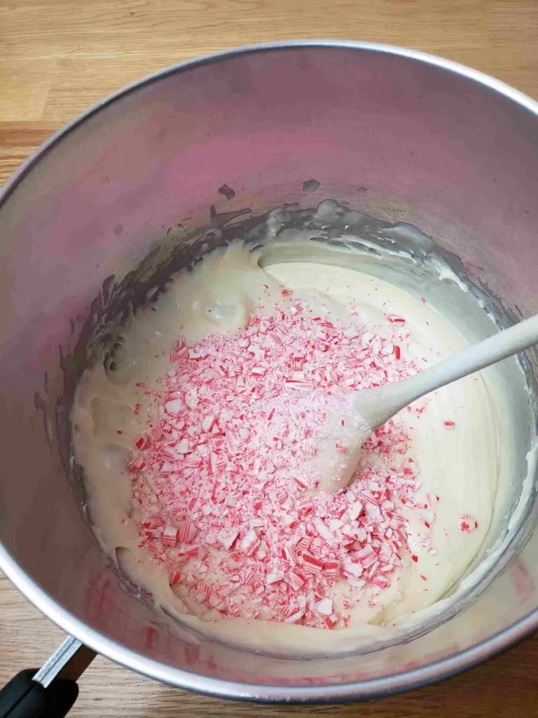 adding candy canes, salt and peppermint extract to milk and chips