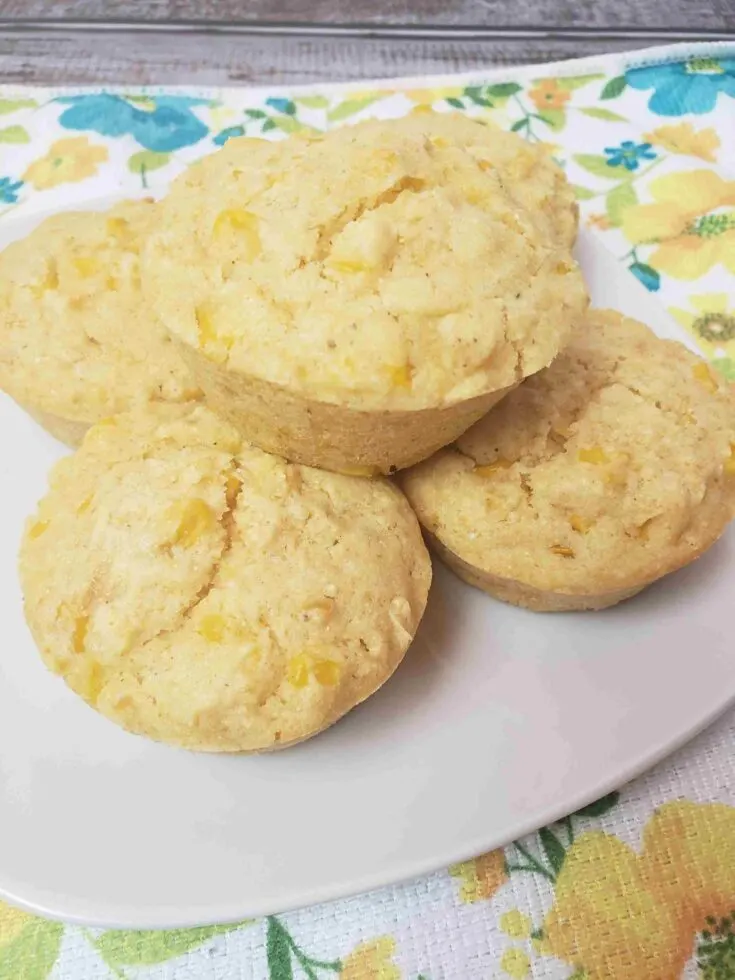 5 amazing cornmeal muffins served on a white plate