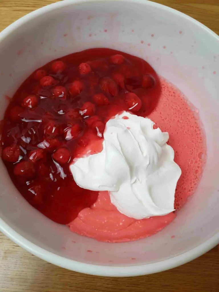 adding cherry pie filling to jell-o mixture