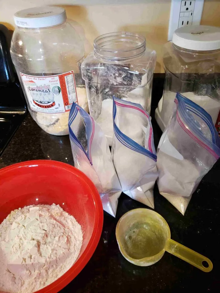 adding dry ingredients to quart bags for amazing cornmeal muffins