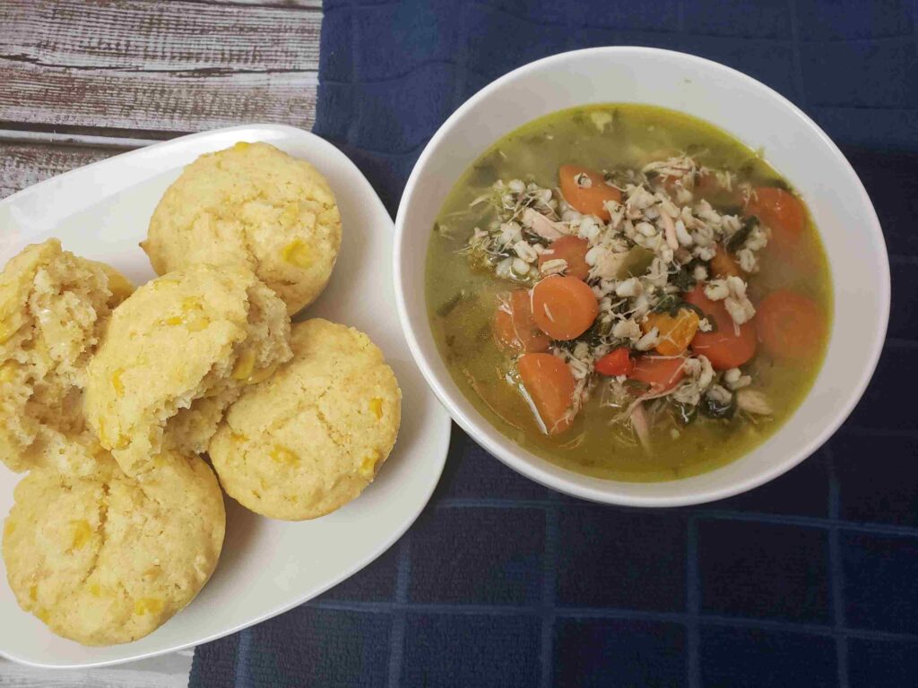 amazing cornmeal muffins served next to chicken barley soup