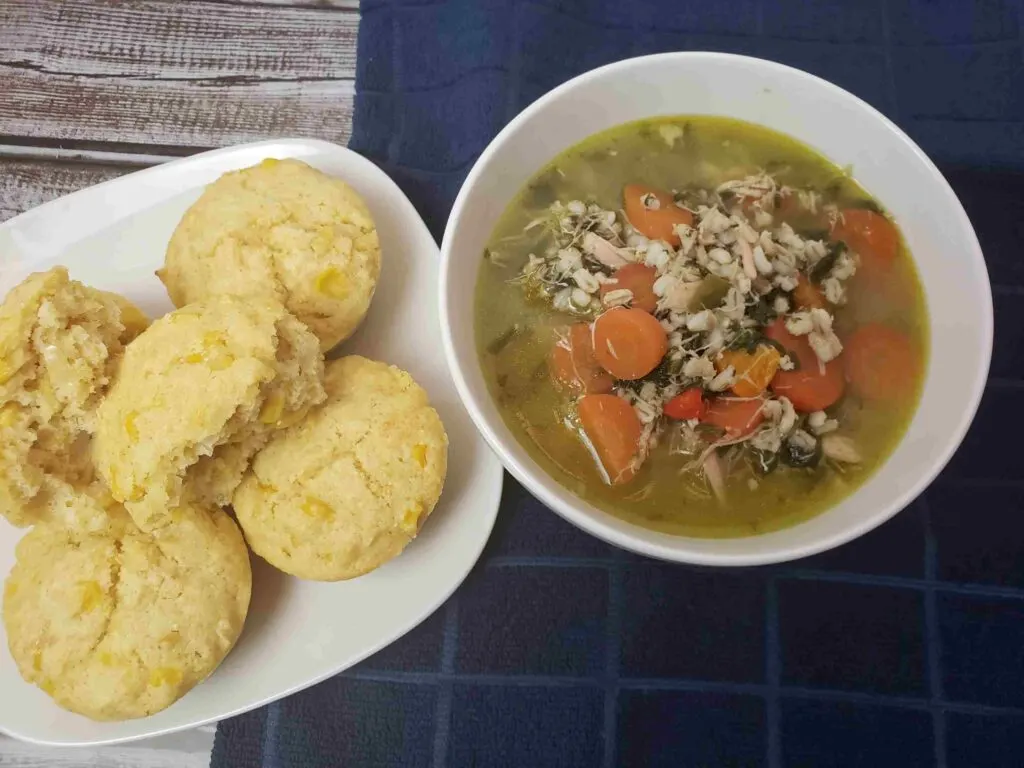 amazing cornmeal muffins served next to chicken barley soup