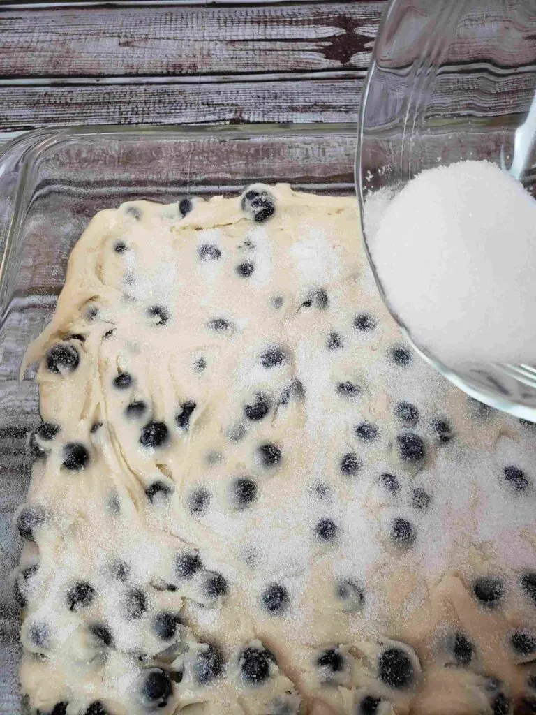 sprinkling sugar over the top