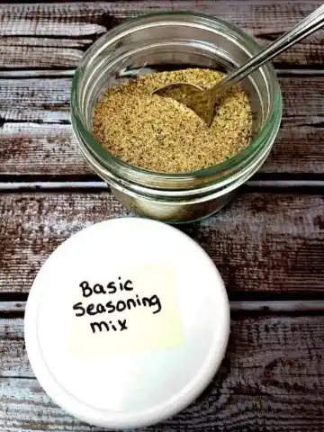 basic seasoning mix in small jar with a spoon