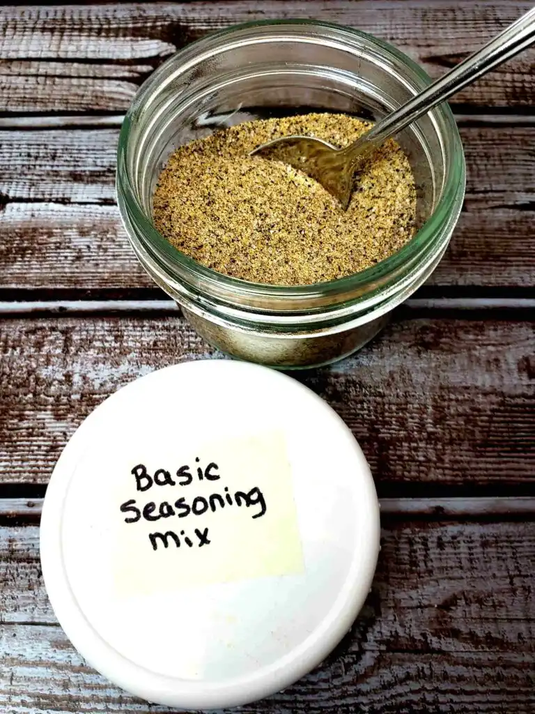 basic seasoning mix in small jar with a spoon