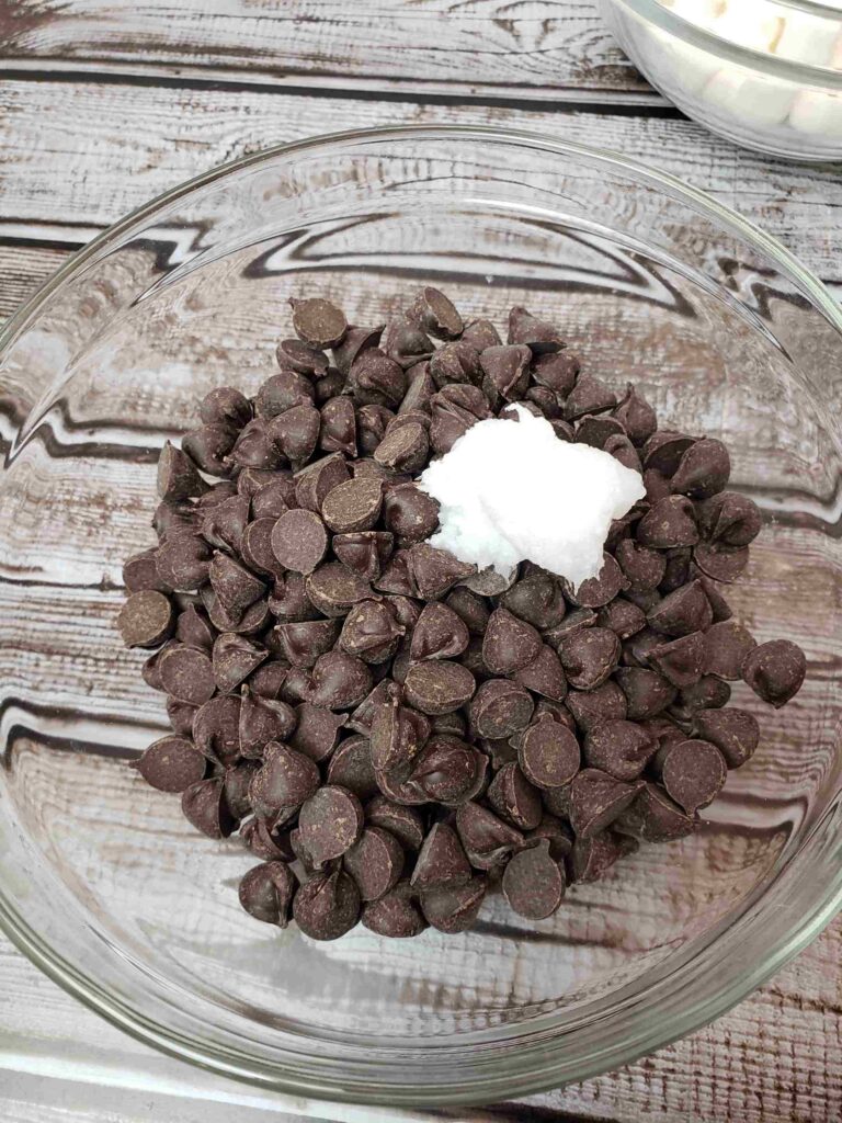 chocolate chips and coconut oil in a glass bowl