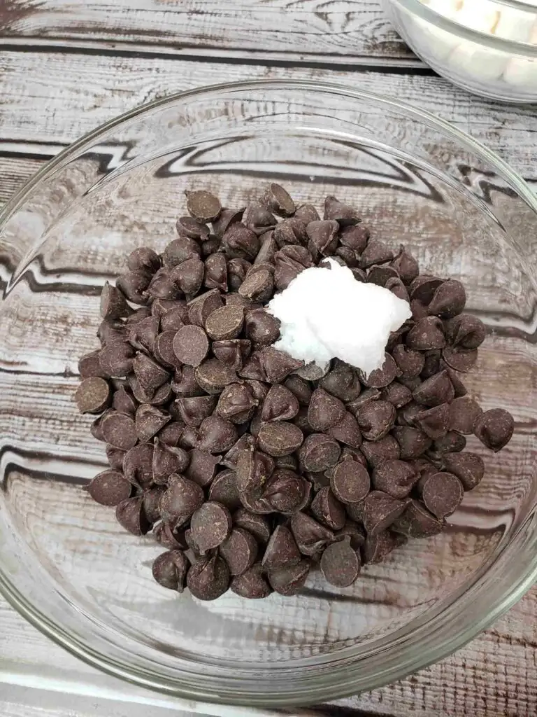 chocolate chips and coconut oil in a glass bowl